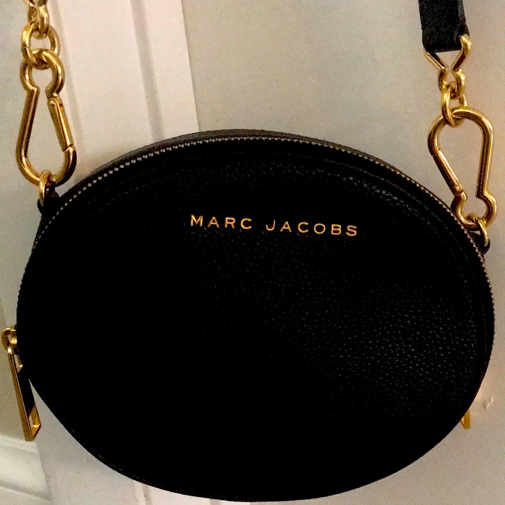round crossbody bag with gold tone hardware